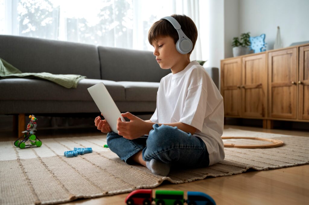 little boy watching films laptop 1