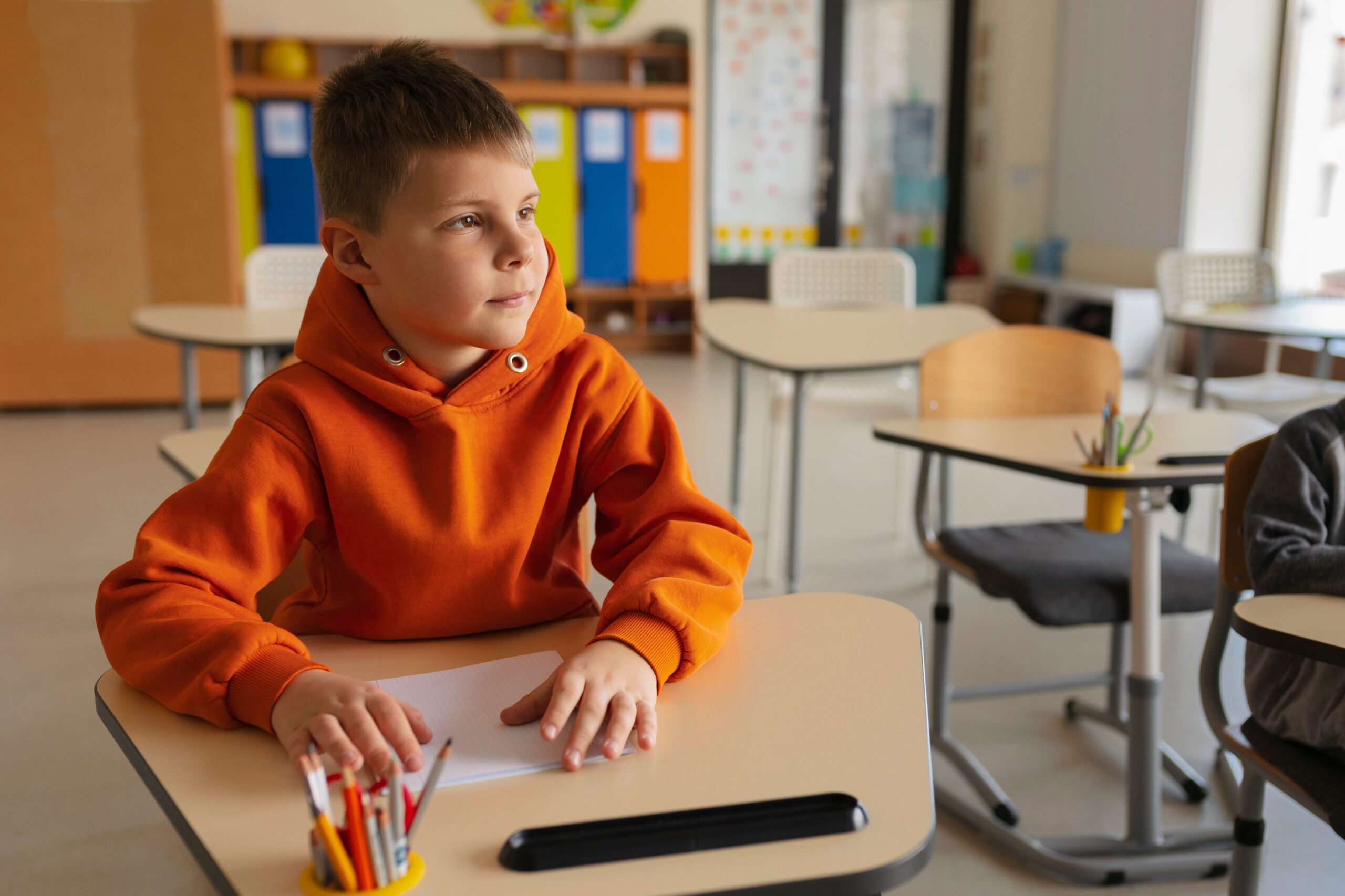 medium shot boy sitting school 1 scaled