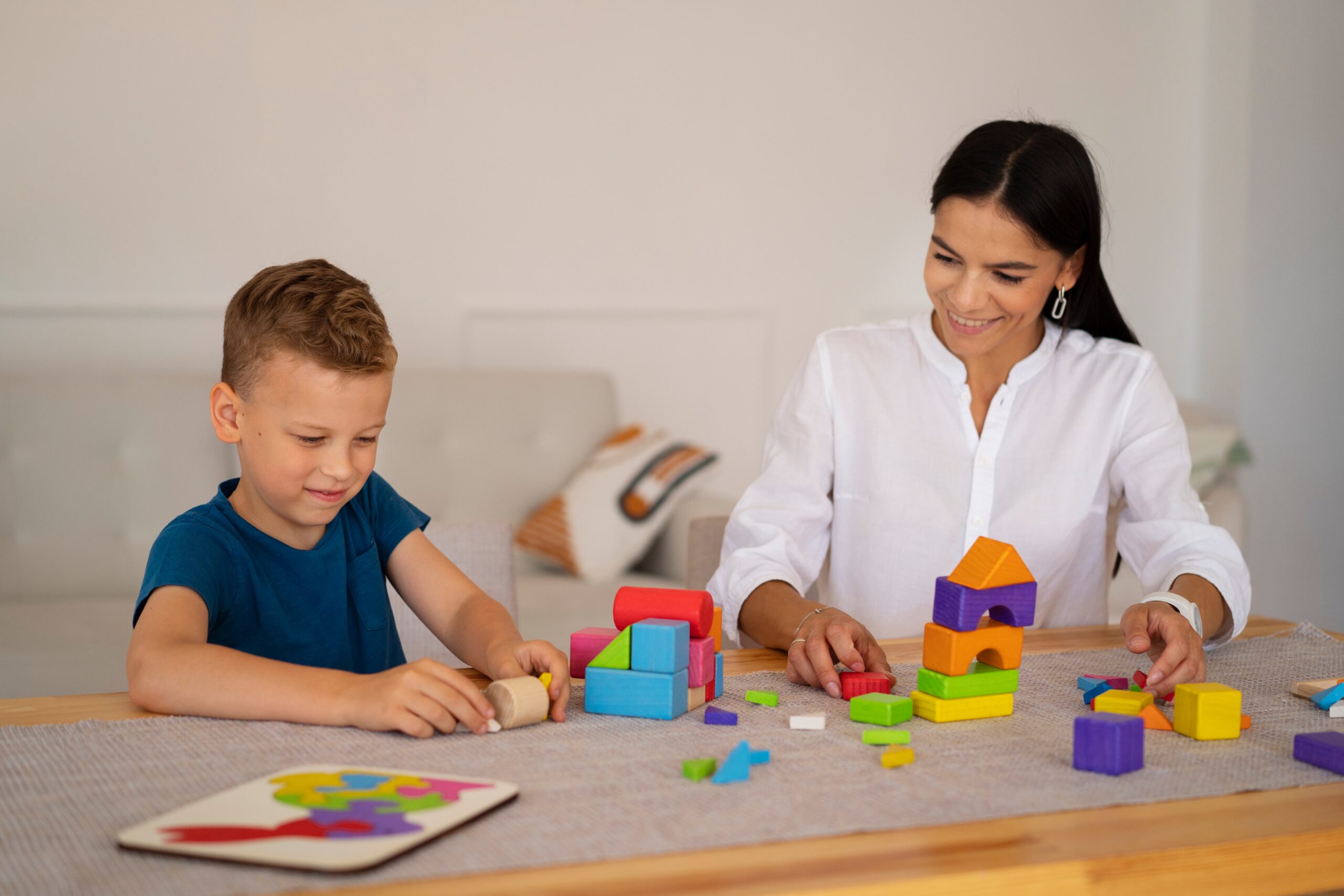 child with their mom playing brain teaser 1 scaled