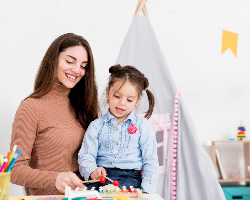 woman playing with young girl home 1