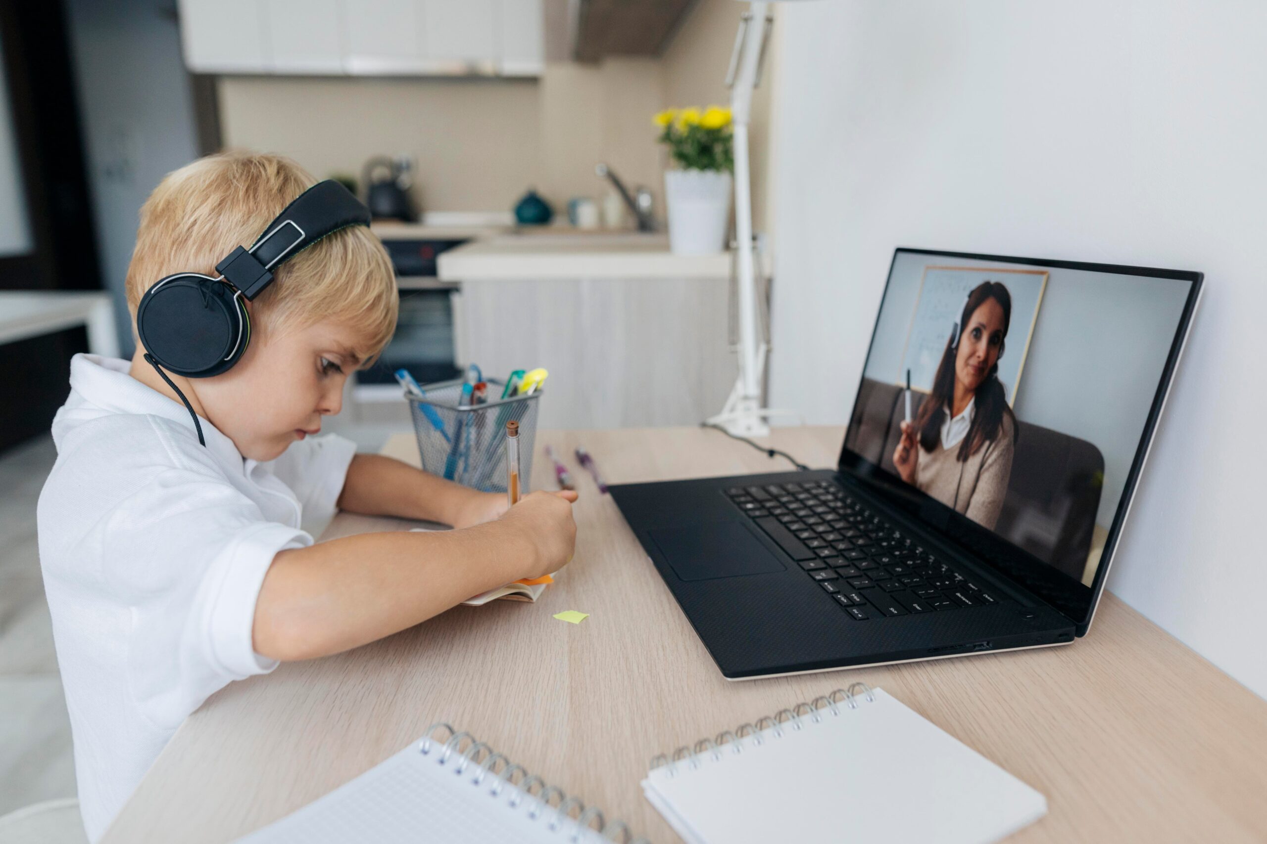 young boy paying attention online class 1 scaled