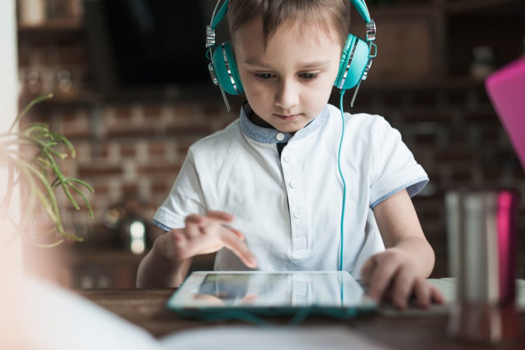 boy with headphones using tablet 1