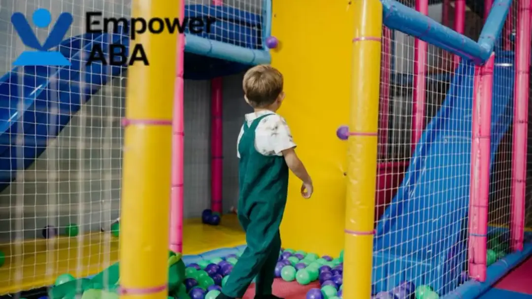 Autism vestibular therapy: a young toddler calmly navigates a colorful obstacle course indoors.