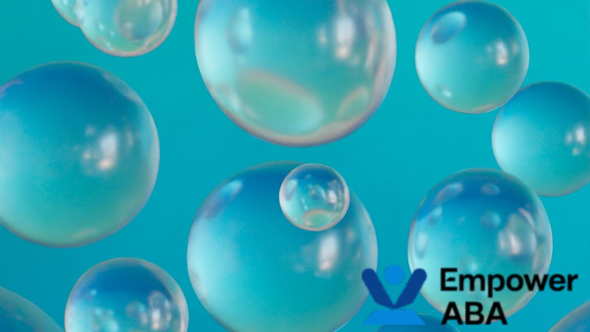 Globs of colorful bubble liquid submerged in a sensory bubble tube, creating a soothing visual effect.