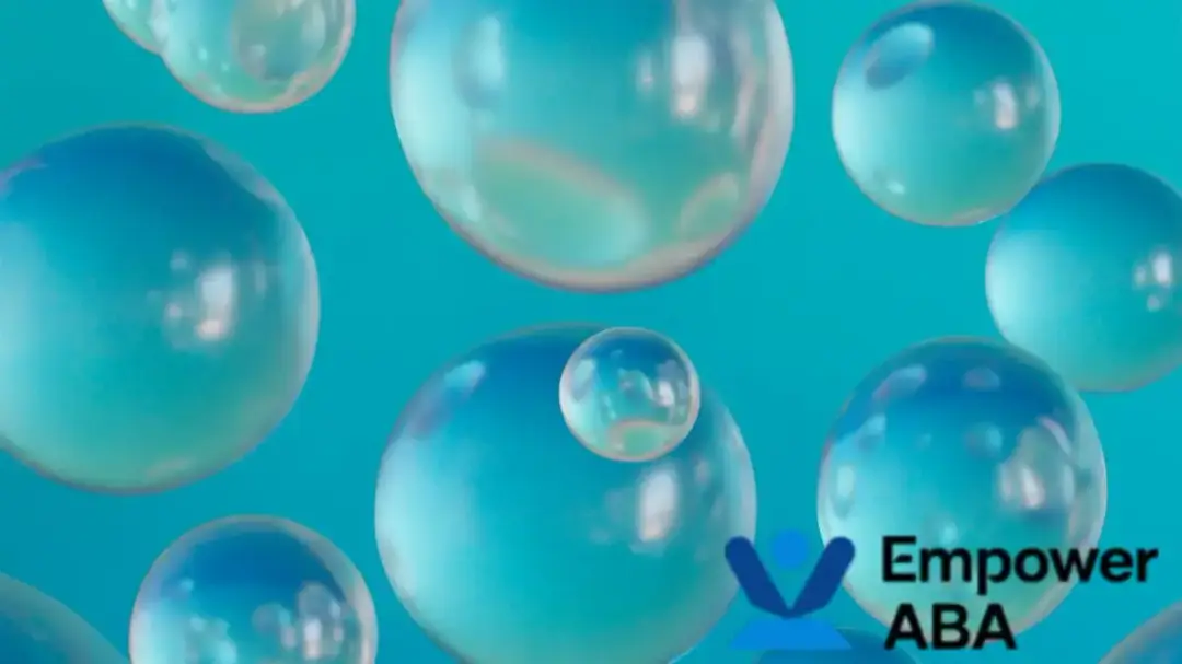 Globs of colorful bubble liquid submerged in a sensory bubble tube, creating a soothing visual effect.